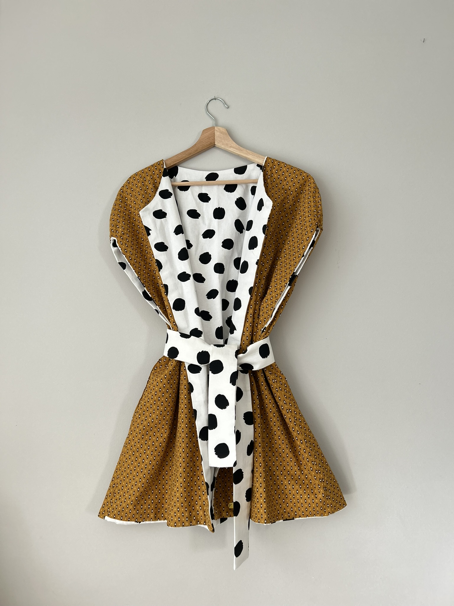 Reversible cotton vest with black polka dot lining