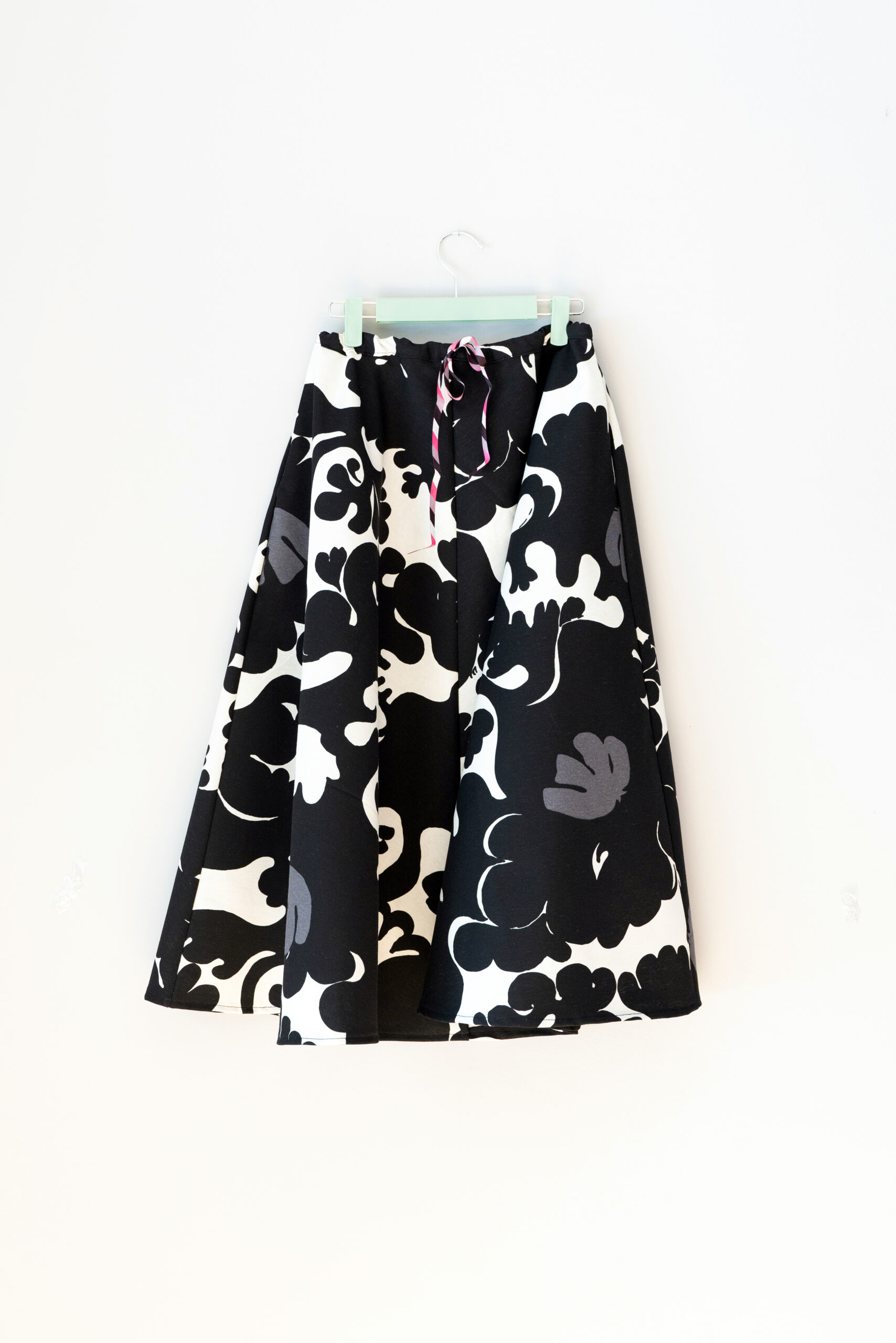 Front view of black and white cotton circle skirt with full silhouette